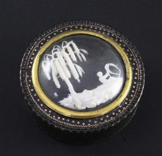 A 19th century green lacquered gold pique work circular snuff box, 3in.